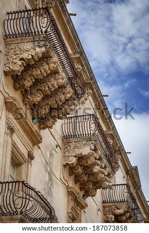 Italy, Sicily, Noto (Siracusa Province),  Villadorata Nicolaci Palace (Unesco monument), baroque ornamental statues under the balconies