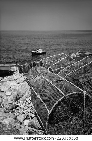 Italy, Calabria, Tyrrhenian Sea, wooden fishing boats and fish traps ashore - FILM SCAN