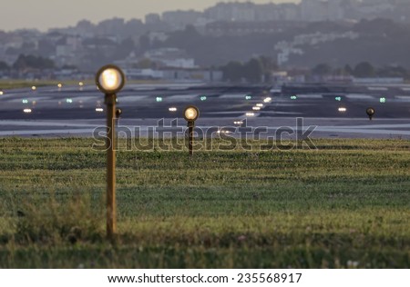 Italy, Napoli International Airport, flight security lights and landing strip in the bakground
