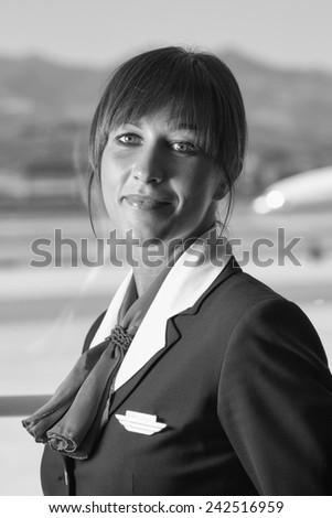 Italy, Sardinia, Olbia International Airport, flight stewardess portrait