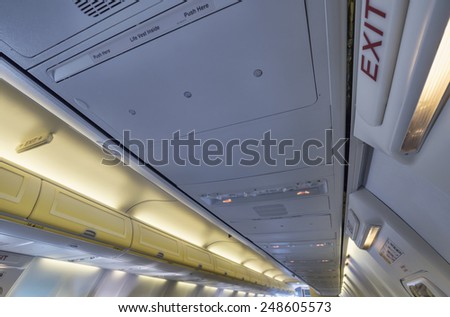 Italy, airplane cabin, emergency exit lights