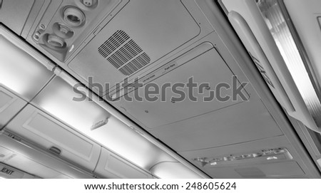 Italy, airplane cabin, emergency exit light