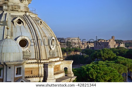 Italy, Lazio, Rome, view of the Imperial Forum and Coliseum at sunset