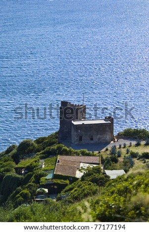 Italy, Tuscany, Tyrrhenian Sea, view of Talamone promontory, old house by the sea