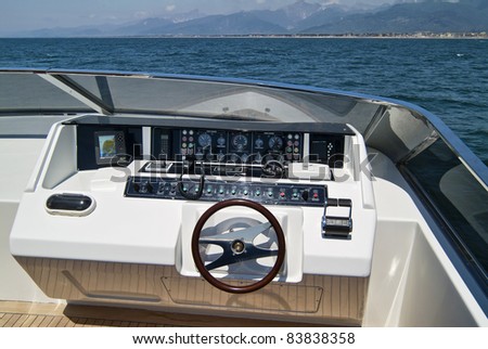 Italy, Tyrrhenian Sea, off the coast of Viareggio (Tuscany), Tecnomar 35 luxury yacht, flibridge, driving consolle