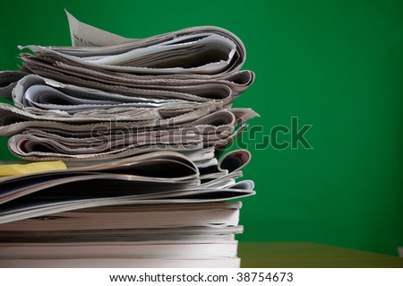 Stack of reading and research magazines and newspaper, a fading way we find information today