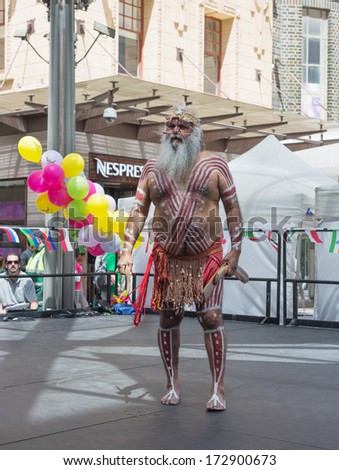 ADELAIDE,AUSTRALIA - NOVEMBER 3: Australian aboriginal in national costume performs at Adelaide Multicultural Festival on November 3, 2013 in Rundle Mall, Adelaide, Australia.
