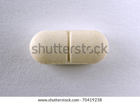 Single Brown Oval Tablet On White Background Stock Photo 70419238