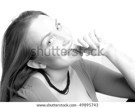 Sly smiling woman, isolated on white. In black and white