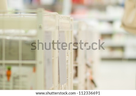 Storage boxes with goods in supermarket