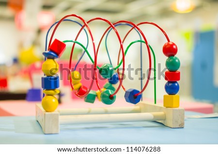 Logic toy with paths and spheres, cubes on table in mall