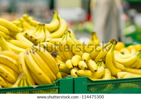 Bunch of bananas in boxes in supermarket