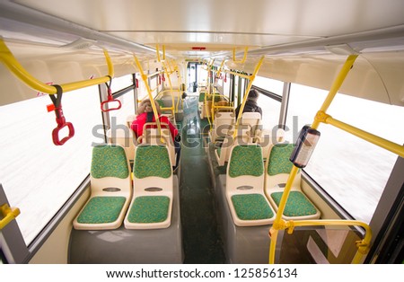 Interior of modern city bus. Seat places in back side of bus. Wide angle shot