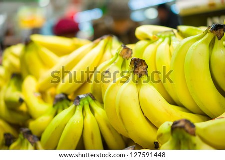 Bunch of bananas on boxes in supermarket