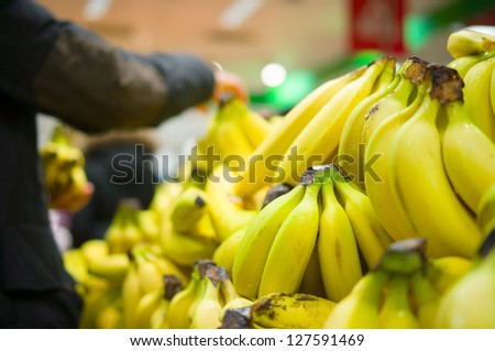 Bunch of bananas on boxes in supermarket