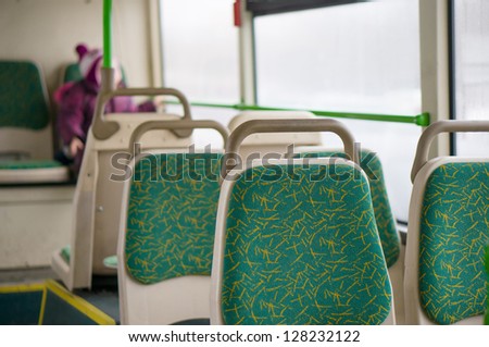 Interior of modern articulated bus. Seat places in back side of bus