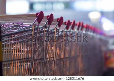 Row of shopping carts at supermarket entrance