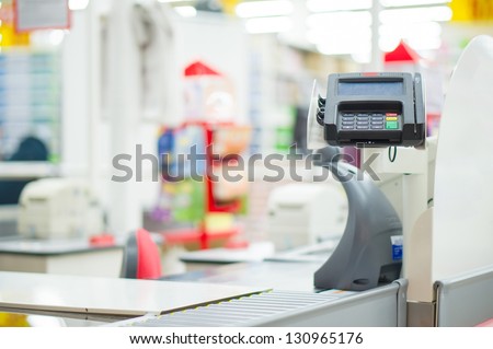 Empty cash desk with card payment terminal in supermarket