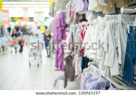 Kids fleece jackets and jeans in supermarket
