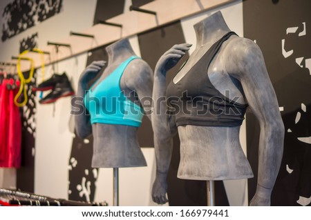 Woman mannequins in sport light tops bra on stands in sport store
