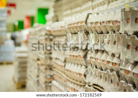 Bunch of egg pallets on shelves in supermarket