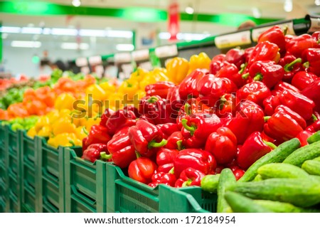 Bunch Of Red, Yellow And Orange Paprika Peppers On Boxes In Supermarket