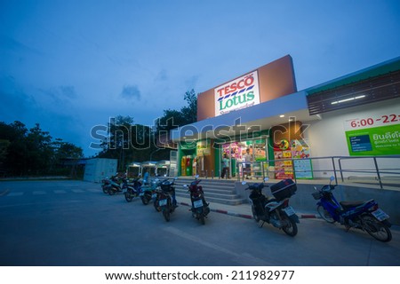Ao Nang, 22 June 2014: Tesco Lotus local shop and parking on sunset at Ao Nang, Krabi province, Thailand.