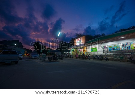 Ao Nang, 3 June 2014: Tesco Lotus local shop and parking on sunset at Ao Nang, Krabi province, Thailand.