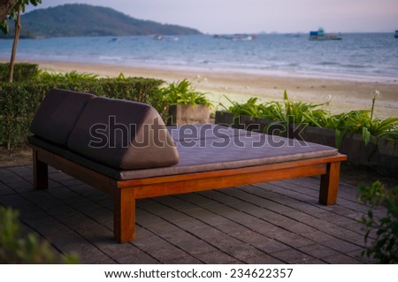 Beach bed on sunset in evening