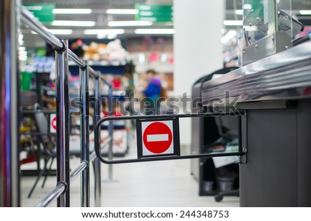 Empty cash desk with closed way border in supermarket