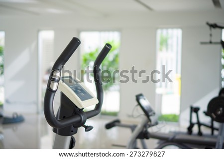 Stationary bicycle standing in a fitness gym