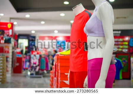 Man and woman mannequin in sport bra and trousers