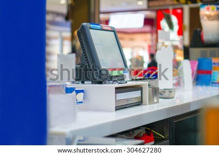 Empty cash desk with computer terminal in cafe