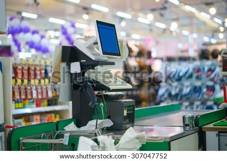 Close up of empty cash desk with computer terminal in supermarket