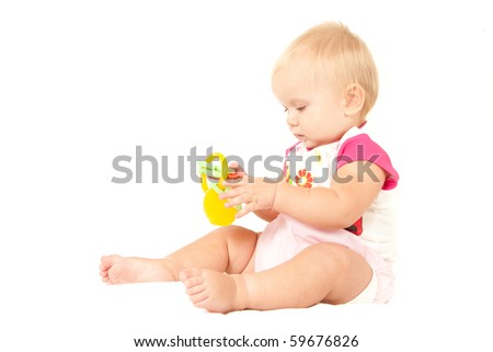 wallpaper baby girl_10. stock photo : Happy cute aby girl (10 months) sitting on bed and playing