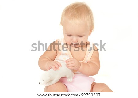 wallpaper baby girl_10. stock photo : Happy cute aby girl (10 months) sitting on bed and playing