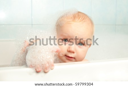 little baby play with bubbles in bath