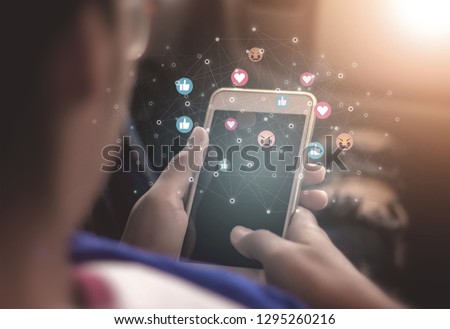 Young women using phones to broadcast live social media concepts, smartphones, social media, social networking concepts with smartphones