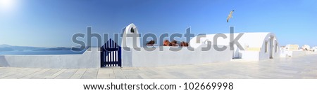 Panoramic view of a Classical Greek architecture of the streets in the Cyclades Greece