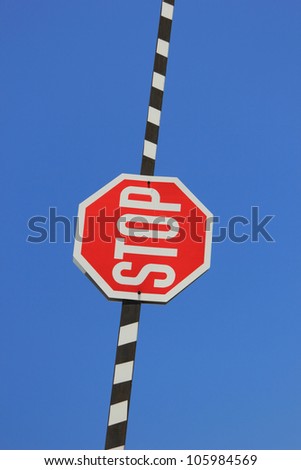 Red stop sign on a barrier gate