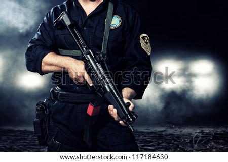 Greek coast guard holding his weapon