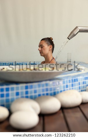 spa hydrotherapy woman waterfall swimming pool water