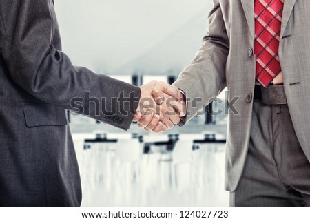 Two business man handshake at the office building