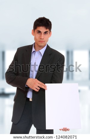 young Business man at the office holding a white board