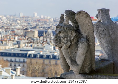 Paris wit Gargoyle architectural fragment in foreground, taken from the roof of Cathedral Notre Dame