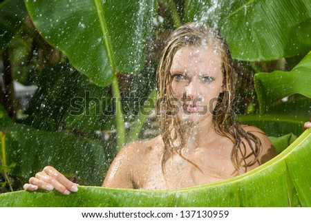 woman in tropical shower in the summertime