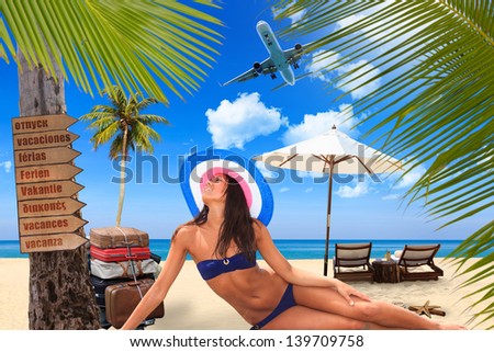 Young woman reaxing on the beach at exotic resort TRavel concept