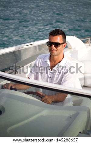 The man has a rest on a yacht in voyage
