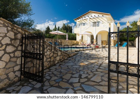 Entrance gate of a luxurious villa with pool resort in Greece