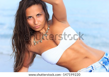 Charming woman  girl sitting at stern of the ship